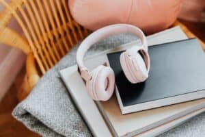 wireless headphones on top of the books